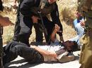 _imemc_org_attachments_oct2007_iyad_bornat_being_attacked_by_israeli_soldiers_during_bilin_protest__file_2007.jpg