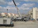 imemc_org_cache_imagecache_local_attachments_may2008_400_0___10000000_0_0_0_0_0_israeli_trucks_installing_the_mobile_homes_at_mitetyaho_mizrah_settlement_on_monday.jpg