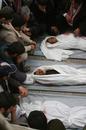 monkeysmashesheaven_files_wordpress_com_2009_01_the_funeral_of_three_children_from_al_astal_family_killed_by_the_israeli_shelling_on_their_home_on_friday__photo_by_wafa.jpg